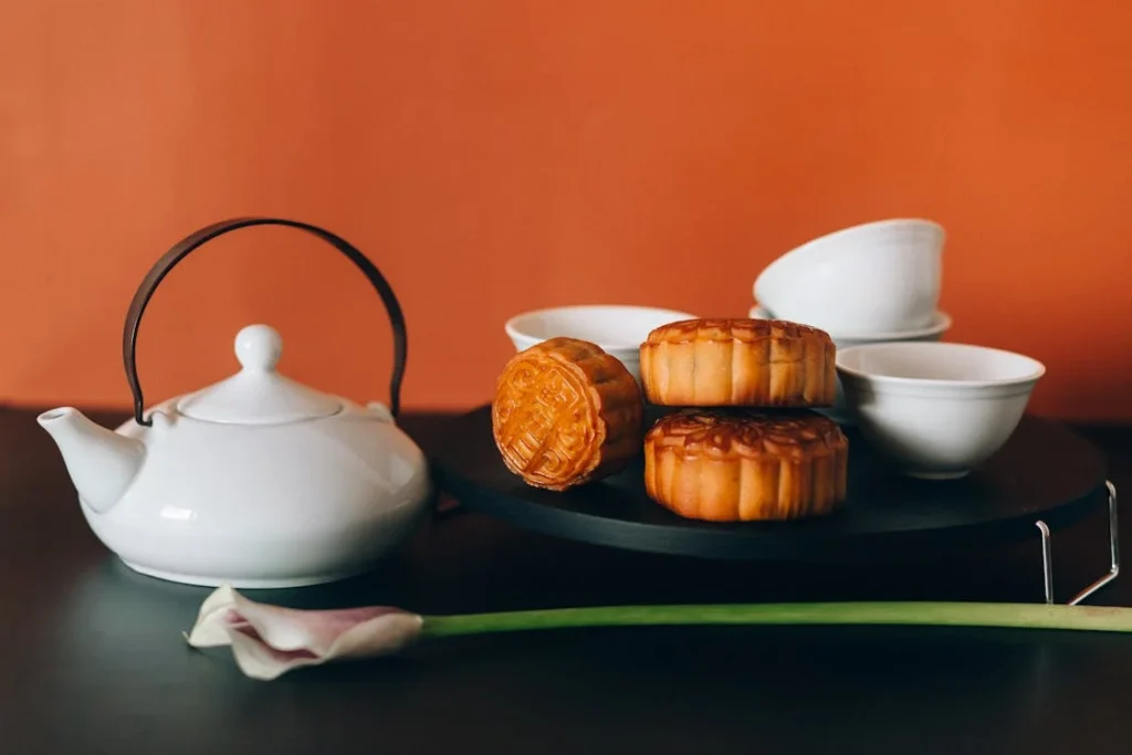 An image depicting mooncakes and tea. Using local customs when branding for cultural differences can help with reliability. 