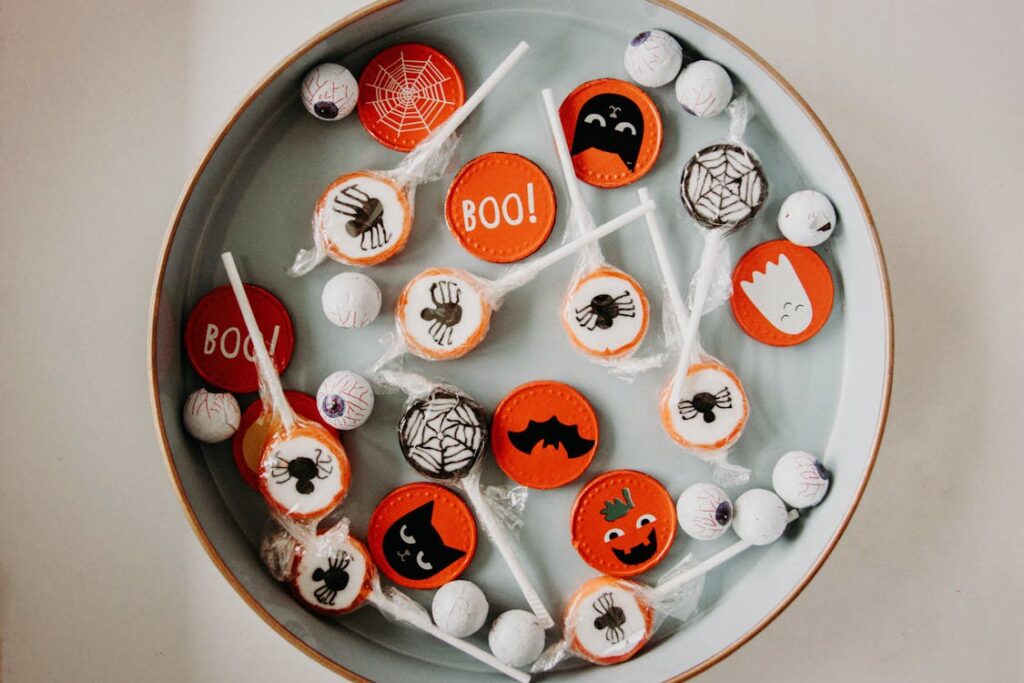 A bowl of candies with a Halloween aesthetic to them, an example of fear-based marketing during the season.
